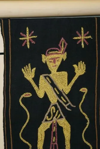 Rare old ceremonial hand spun hand woven black hemp textile loin cloth, Protective royal ancestor motif guarded by marine animals, Embroidery is hand twisted bark rope fiber twine. Melolo Village Sumba Indonesia (RE2) 35" x 13.5"